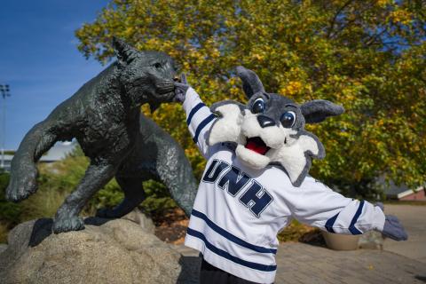 UNH mascot with the Wildcat statue