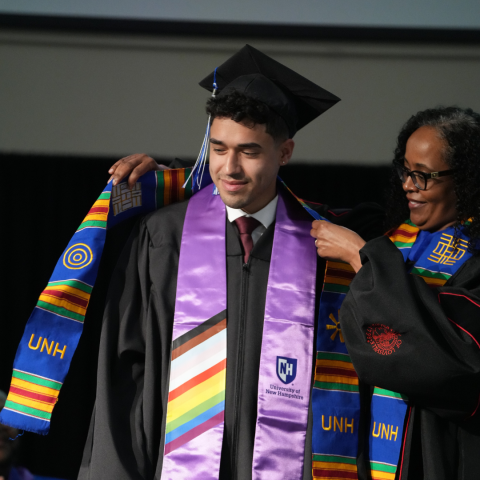 Graduate receiving a kente cloth stole 