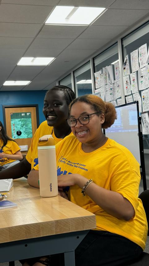 Two CONNECT Mentors in yellow shirts 2024