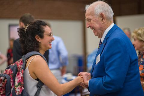 Man shaking a woman's hand