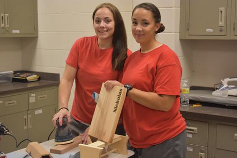 Women in the Prison Outreach Program working on their projects (courtesy photo).