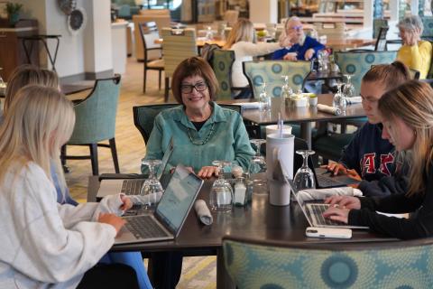 Riverwoods resident Sharyn Zunz interacts with students from UNH's Function and Wellbeing of Older Adults course.