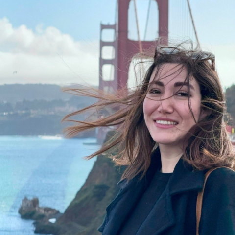 person standing outside with the Golden Gate Bridge in the background