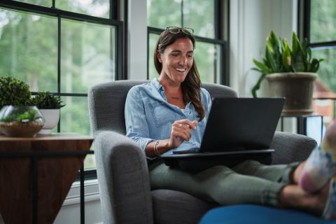 Working professional completes an online course at home.