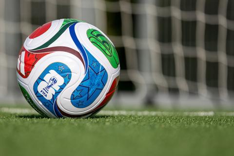 Stock image of a FIFA soccer ball on grass