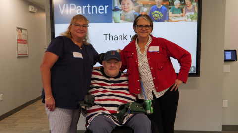 MCD alum and Easterseals NH & VT CEO Maureen Beauregard posing with a staff member and a client