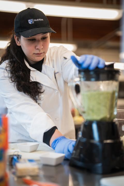 UNH Nutrition Student in a cooking class