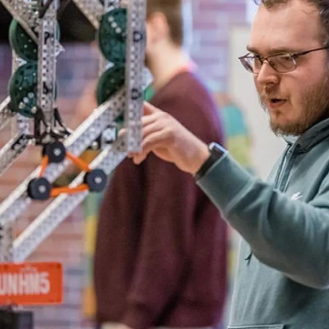 student working on robotics equipment