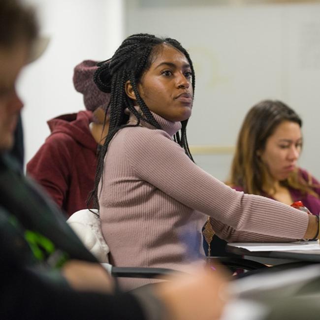 student taking notes in class