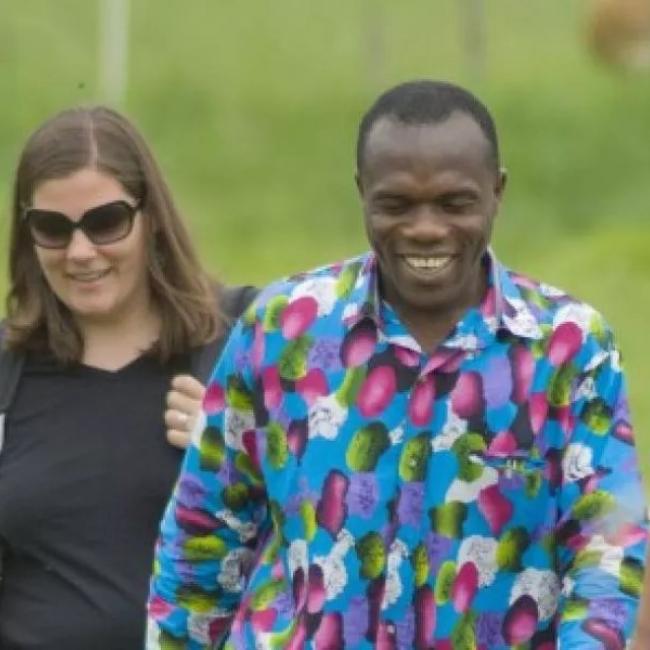 two people walking outdoors