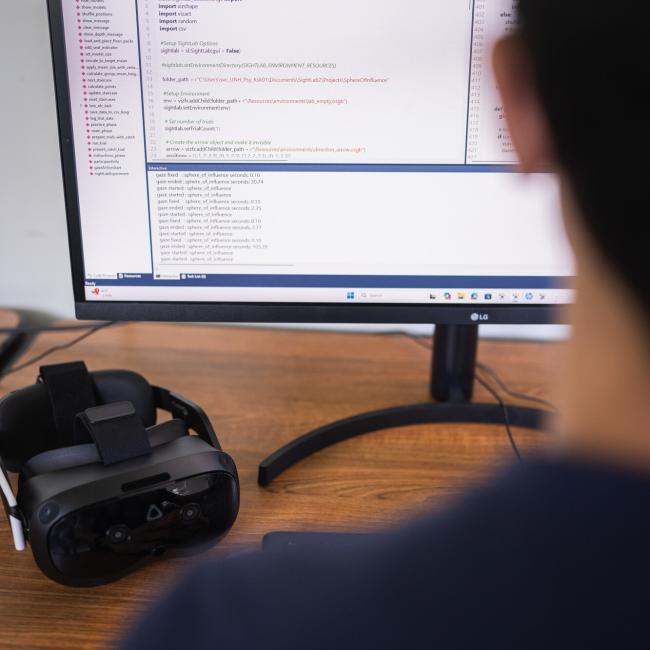 UNH student looking at data
