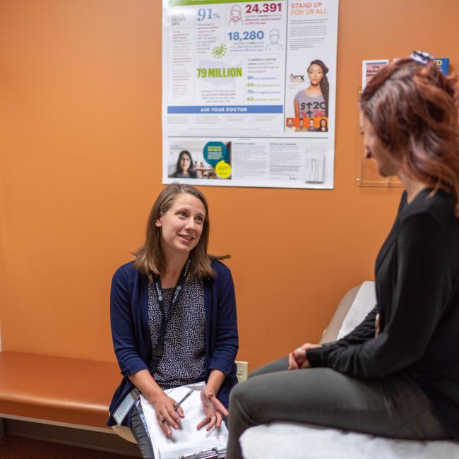 Decorative image of a nurse practitioner meeting with a patient