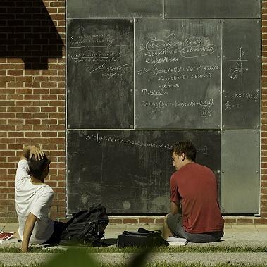 students sitting outside studying