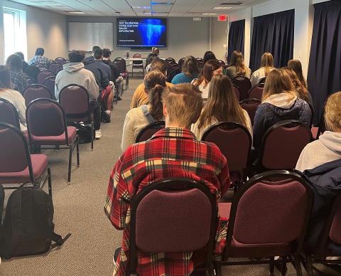 Students getting seated and arriving for a presentation during Undeclared Week