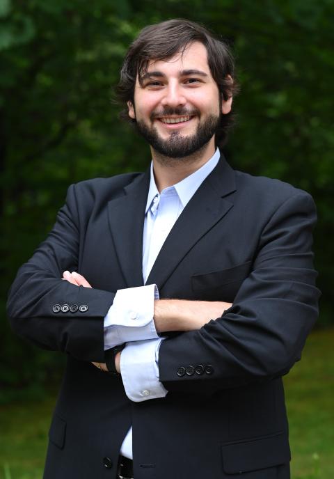 2024 McNair scholar, professionally dressed, smiling, male, outside