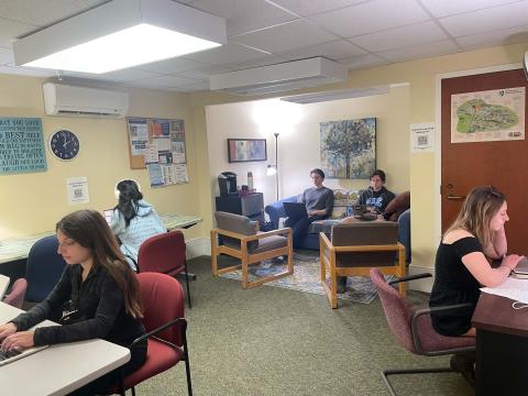 Photo of the CFAR lounge with students studying.