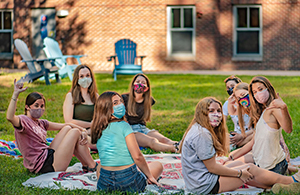 students meeting outside socially distanced