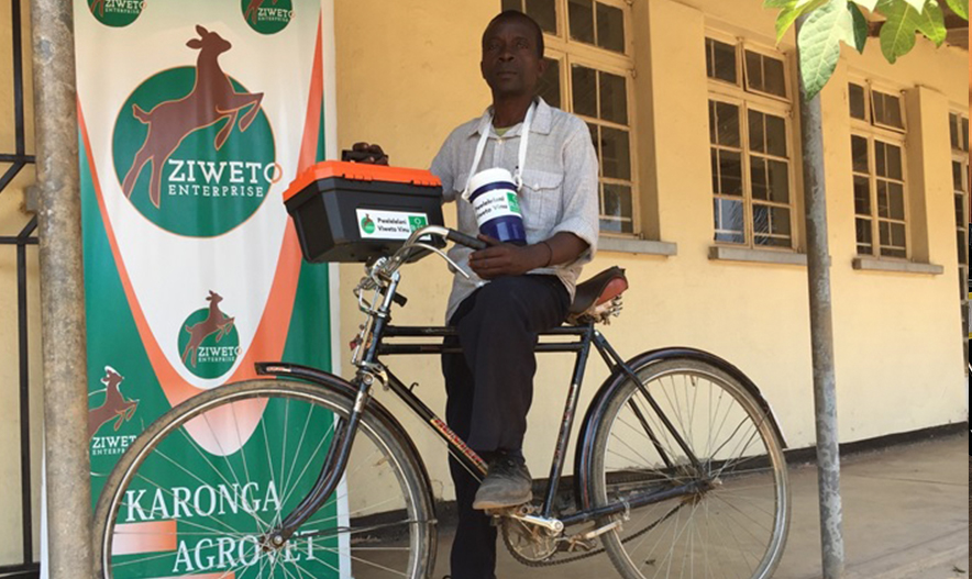 man on bike next to Ziweto sign