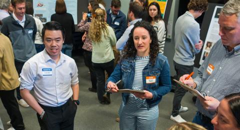 students presenting at a poster session