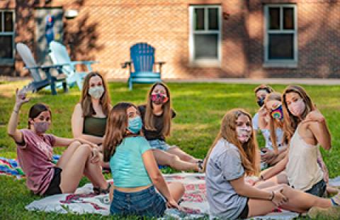 students meeting outside socially distanced