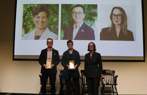 people on stage holding awards