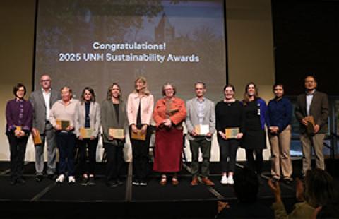 people on stage holding awards