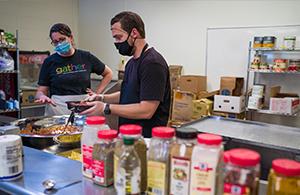 two people working in the kitchen