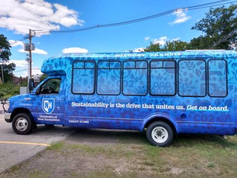 bus wrapped in sustainability icons