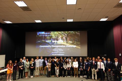 students and teachers standing for photograph