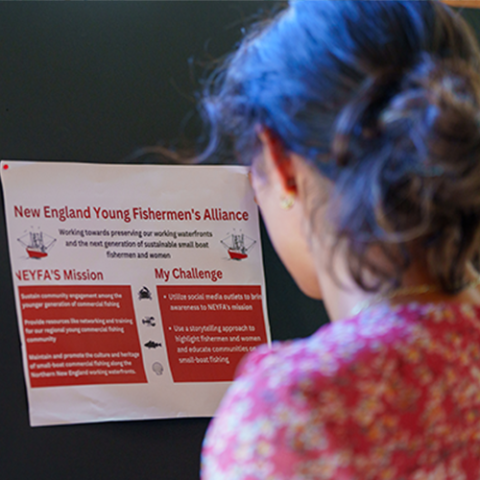 Bella setting up poster