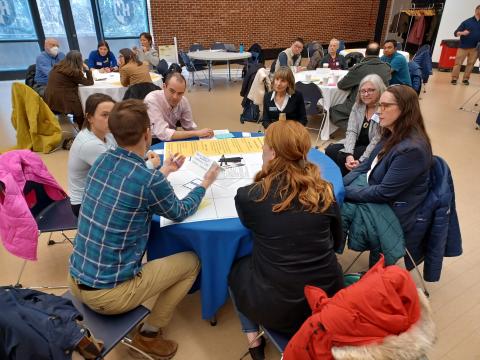 group of people at a round table talking