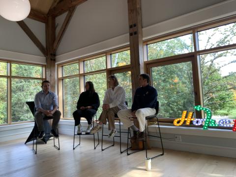 four panelists in chairs