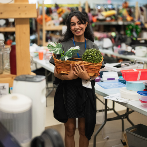 person holding a basket with items inside