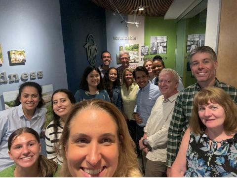 selfie of a group people inside smiling