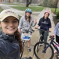 students standing with bikes