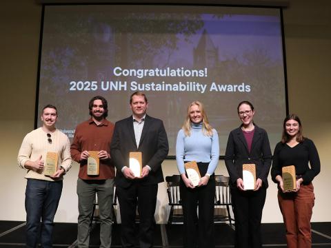people on stage holding awards