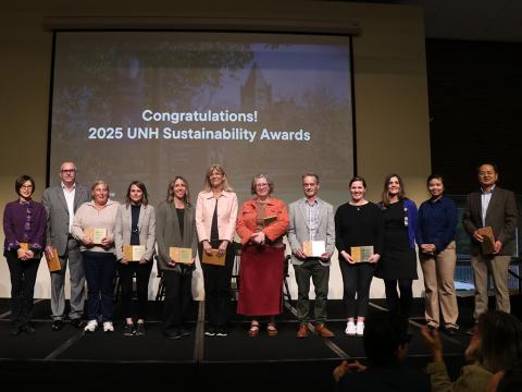 people on stage holding awards