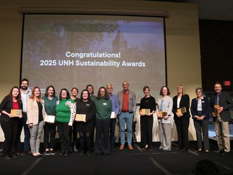 people on stage holding awards