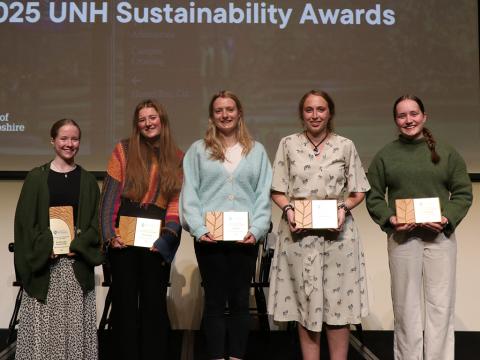 people on stage holding awards