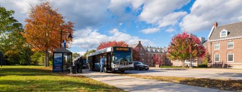 Wildcat Transit Bus at a bus stop in fall.