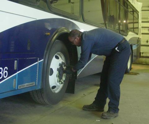 Man working on a bus