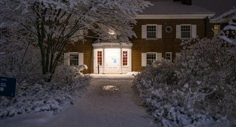 Picture of Hood House after hours in the winter with snow
