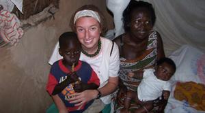 Ashley Barbour holding child in Ghana
