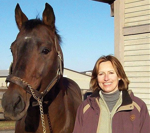 UNH alumna Susan J. Bruns ’78 ’95G with a horse