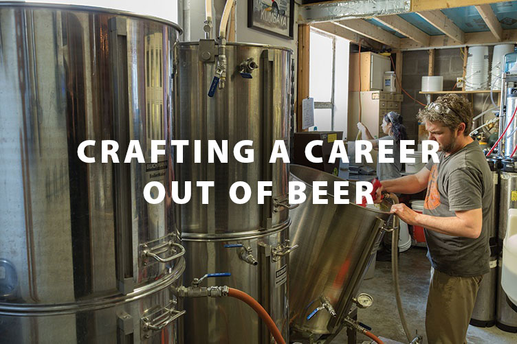 man cleaning out brewery equipment