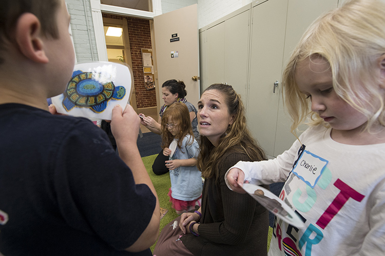 student working with children