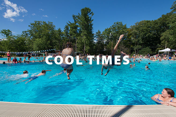 kids jumping into the UNH Outdoor Pool