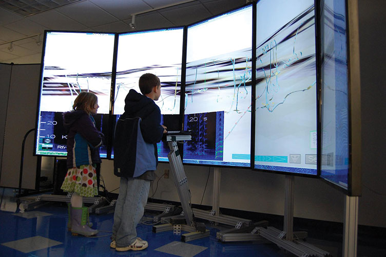 kids looking at a screens during UNH's ocean discover day