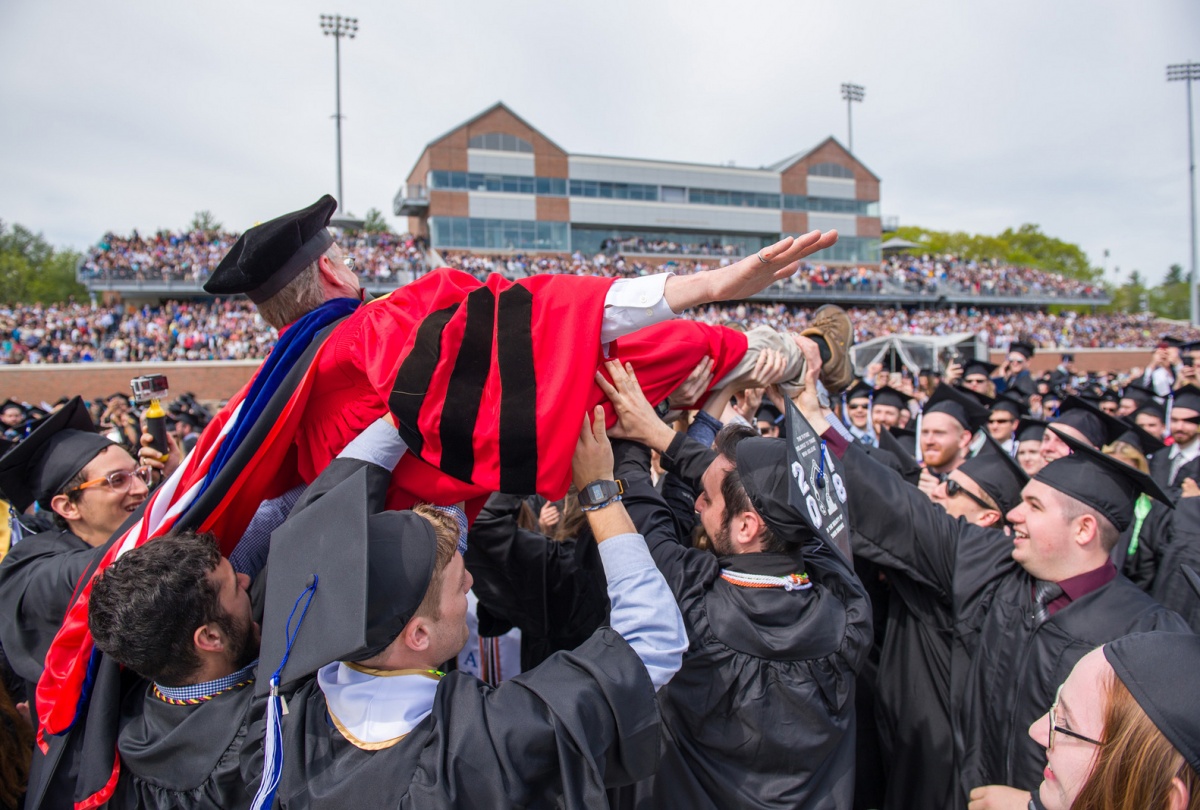 UNH professor crowdsurfing during commencement 2018