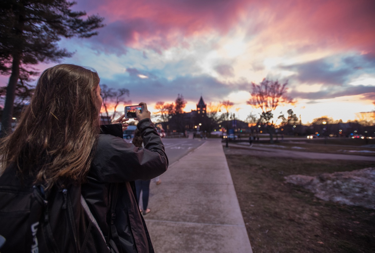 sunset over Thompson Hall at UNH in Durham, NH